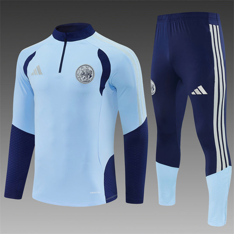 Ajax Half-Pull Trainingspak 'Lichtblauw' 26/27 - VOLWASSENEN