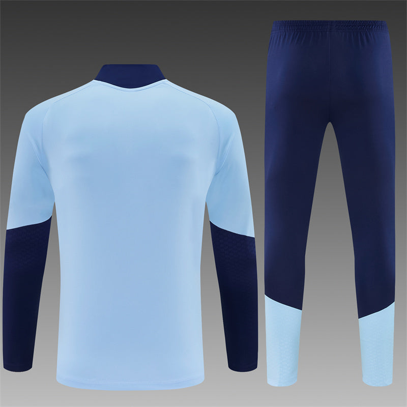 Ajax Half-Pull Trainingspak 'Lichtblauw' 26/27 - KINDEREN