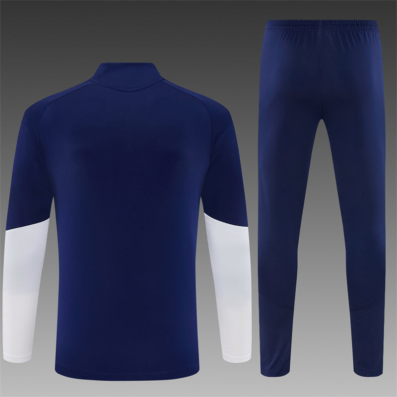 Real Madrid Half-Pull Trainingspak 'Blauw-Oranje' 26/27 - VOLWASSENEN